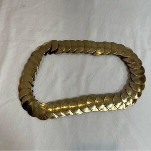 Vintage gold toned overlapping disc stretch belt
One size